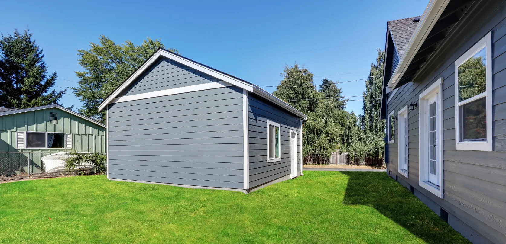 Garage conversion ADU with private side entrance and window installation beside main home in Dallas TX